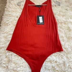 Brand new bodysuit from PLT.
